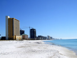Condominium Towers stretch out of the white sands of Panama City Beach, FL as they overlook the Gulf of Mexico